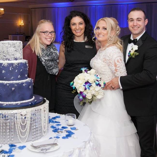 Bride and groom with cake, Falls Manor