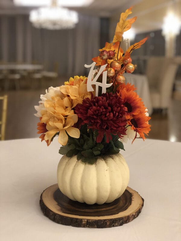 Pumpkin with fall flowers and table #